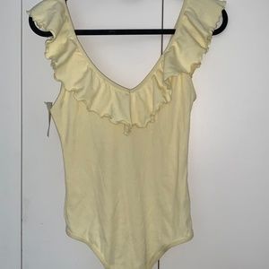 pastel yellow bodysuit